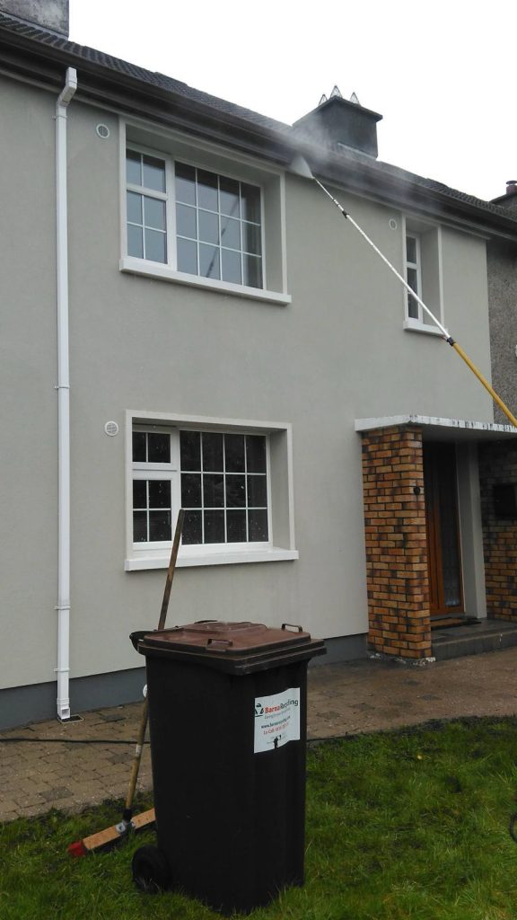 Gutters being cleaned